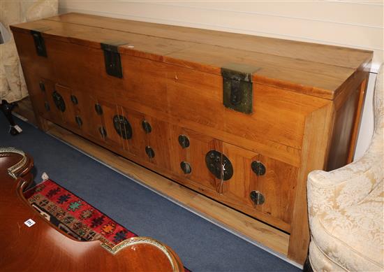 A large Chinese elm side cabinet W.250cm